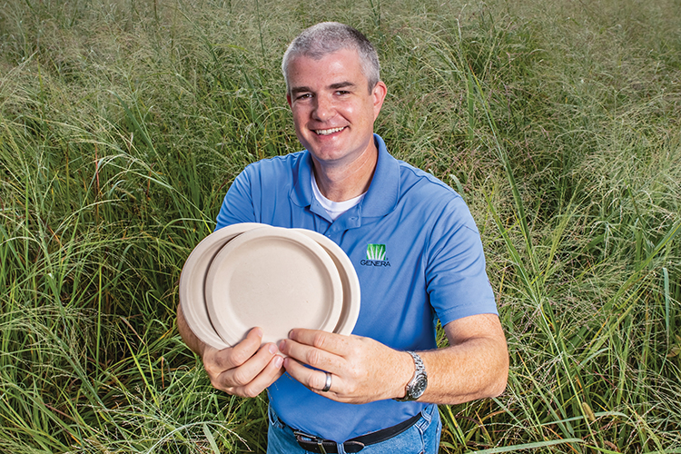 Genera’s Sam Jackson holds biodegradable, compostable plates made using agricultural pulp fiber from Tennessee-grown crops such as switchgrass.
