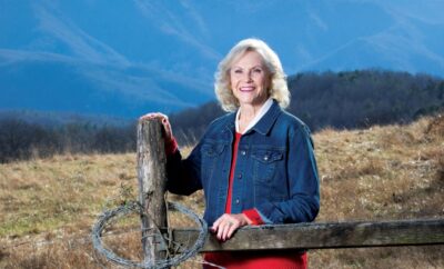 Bettye Carver on her cattle ranch with the Smoky Mountains in the background in Cosby, Tennessee