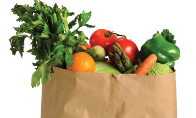 Healthy foods for diabetes prevention in a brown paper grocery bag